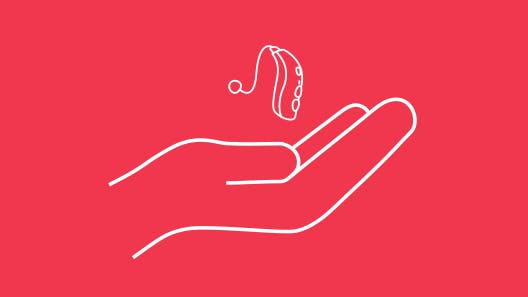 White outline of hand holding hearing aid on red background.